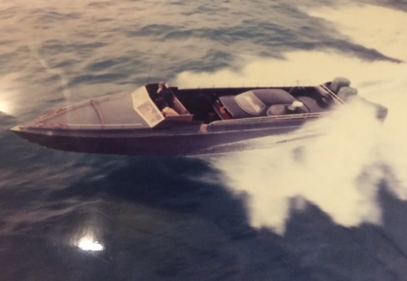 A daai fei with a stolen vehicle at speed across Mirs Bay towards the mainland coast. Taken from an RAF helicopter.