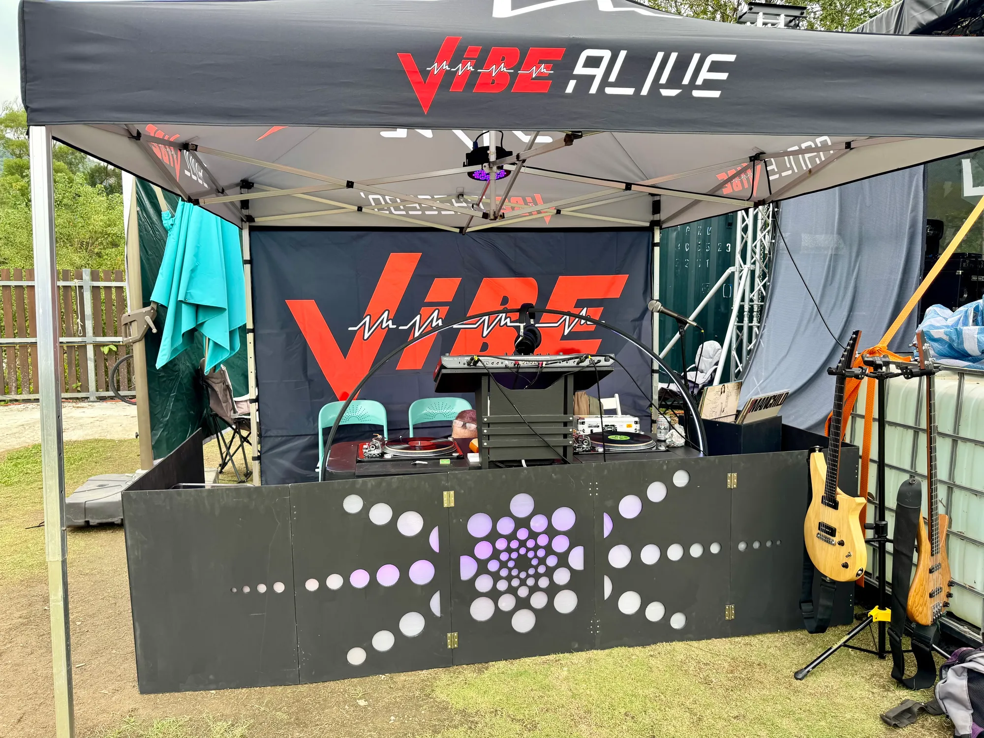 The VIBE Alive DJ tent, with turntables and guitars ready